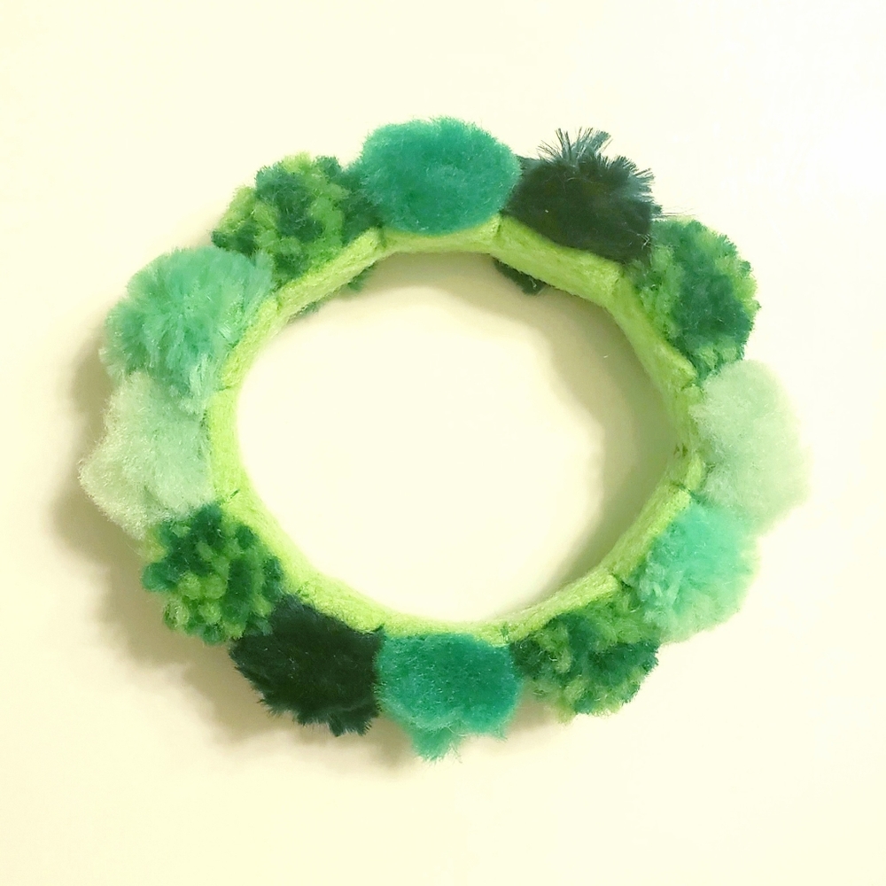 Green pom pom bangle bracelet